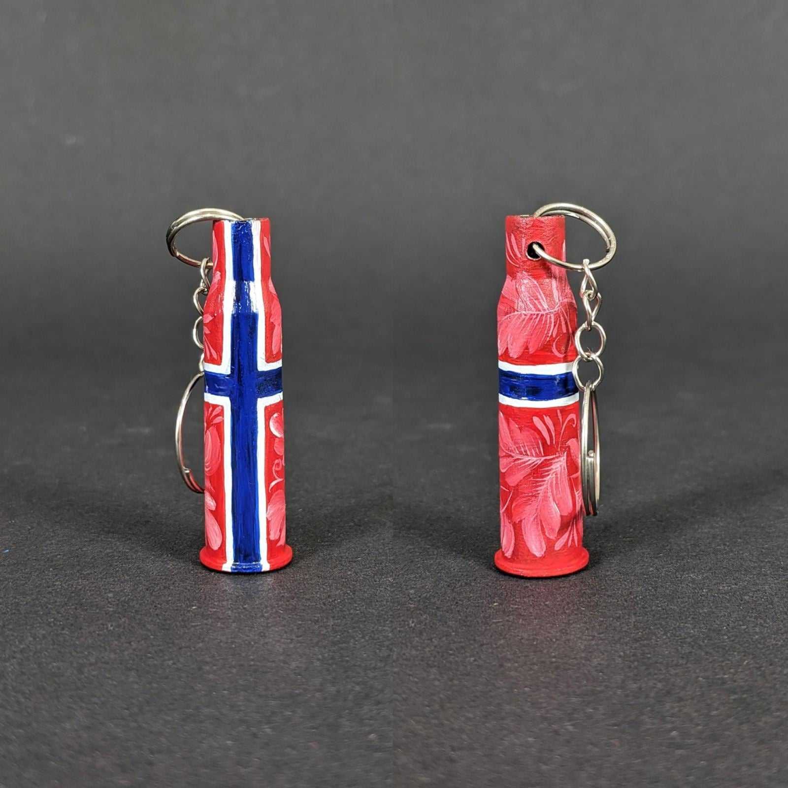 Small caliber keychain painted in Norwegian flag colors representing Norway