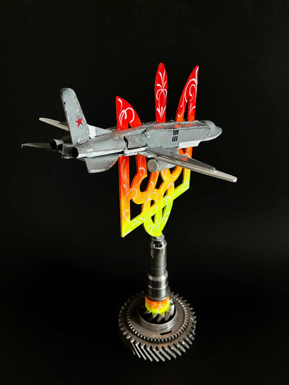 Occupant's downed TU22M3 aircraft impaled on 38cm Tryzub sculpture by Hisoshi Art Studio