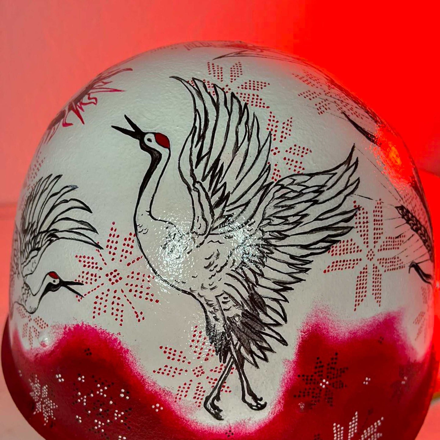 Occupant's helmet decorated with multiple artistic drawings for Victory Gallery fundraiser