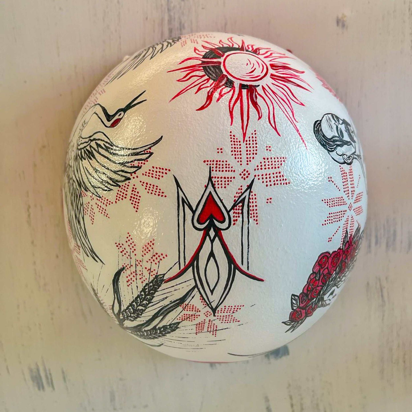 Occupant's helmet with multiple hand-drawn symbols from Ukrainian Victory Gallery fundraiser