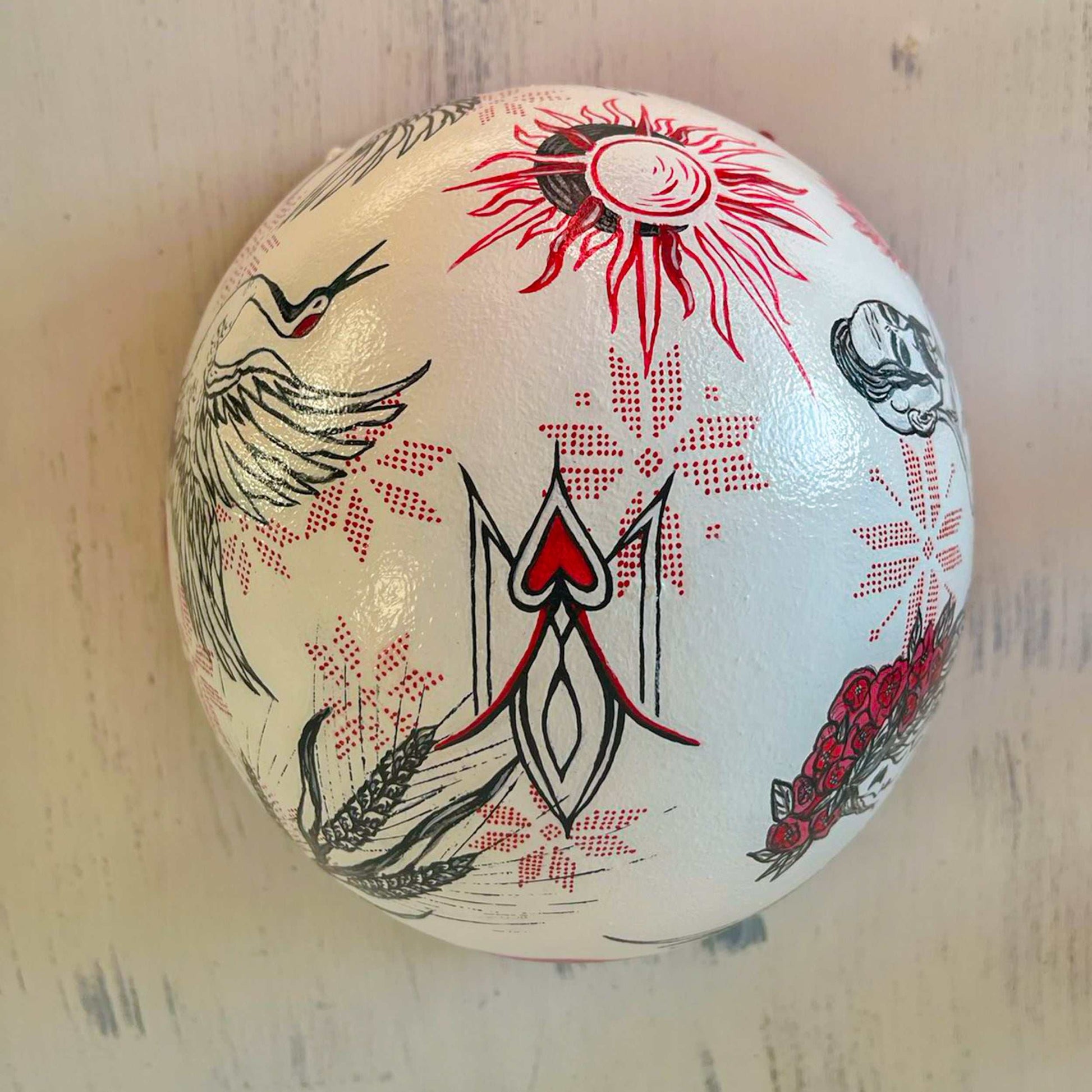 Occupant's helmet with multiple hand-drawn symbols from Ukrainian Victory Gallery fundraiser