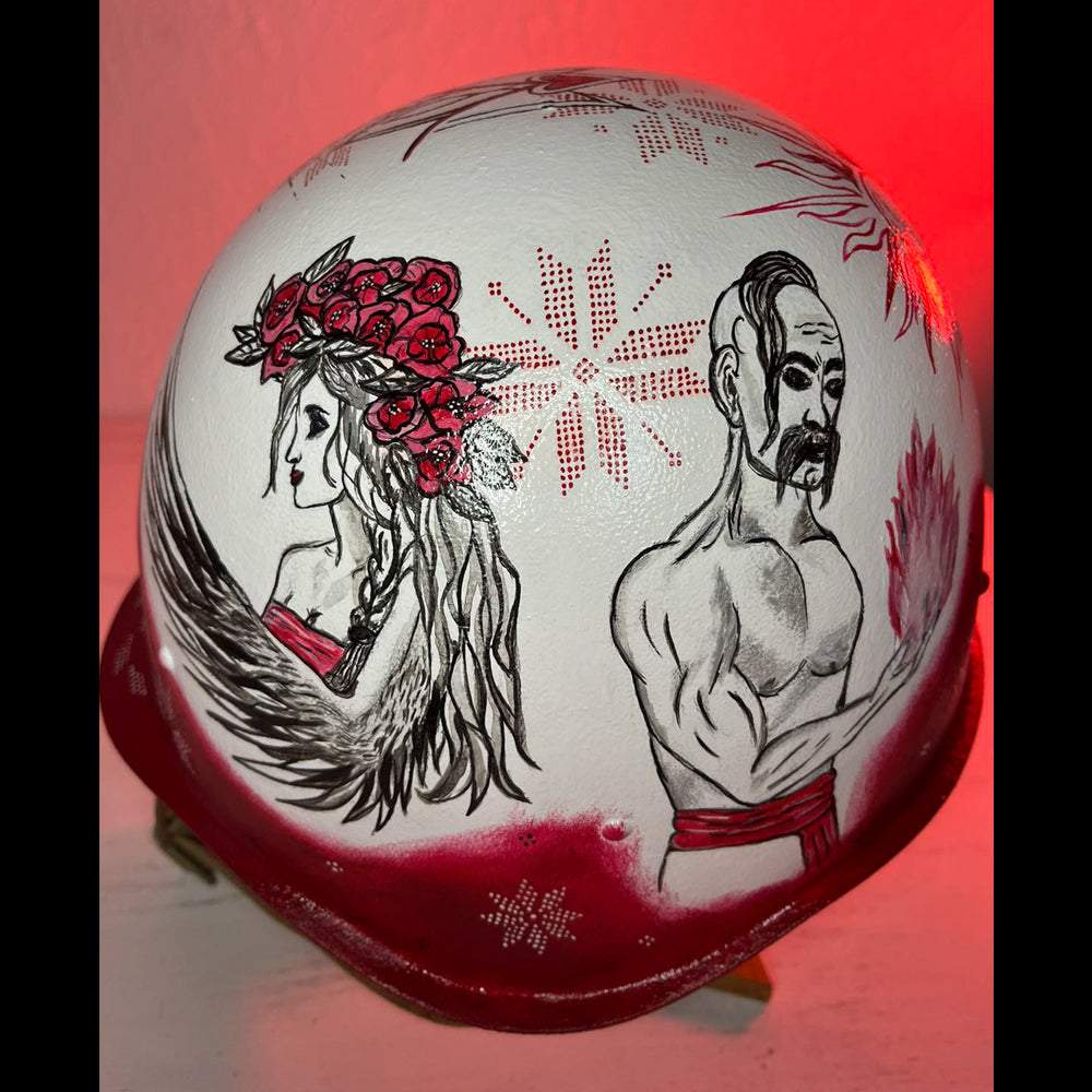Occupant's helmet covered with multiple artistic drawings from Ukrainian artists supporting the war effort