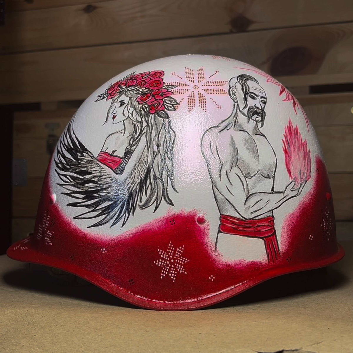 Occupant's helmet with multiple artistic drawings symbolizing Ukrainian resistance against Russian invasion