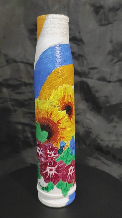 23mm shell with drawing of flowers. (15cm tall).