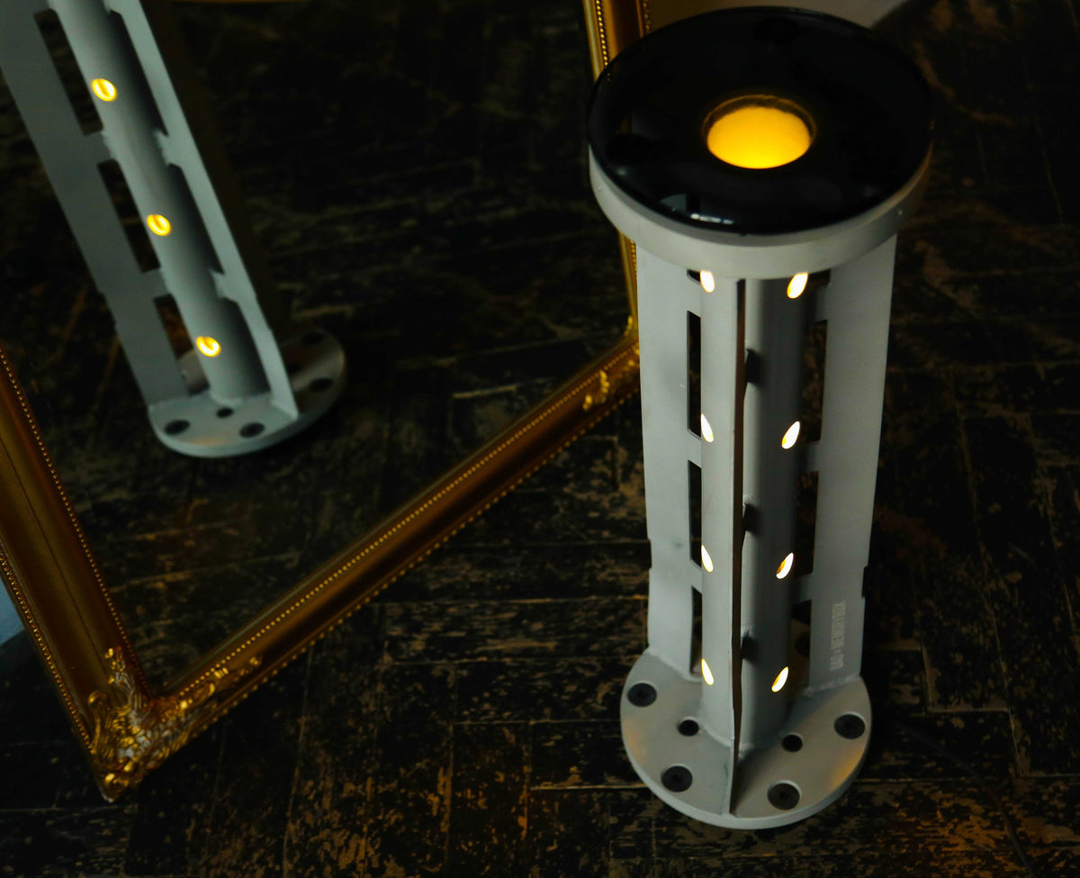 Rocket lamp made from 220 mm 9M27K1 cargo rocket symbolizing light overcoming darkness
