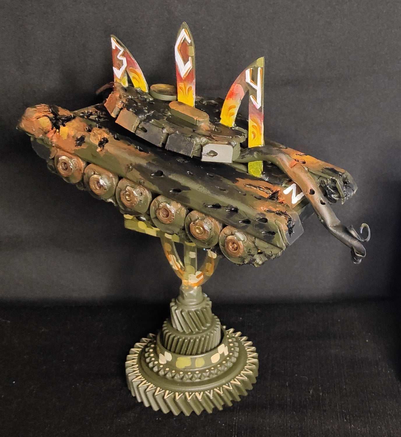 Russian T72 tank model impaled on Tryzub sculpture by Hisoshi Art Studio