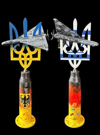Shahed drone sculpture impaled on Tryzub symbol mounted on Gepard shell from Kyiv