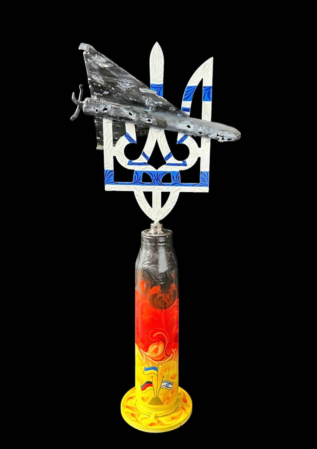 Shahed impaled on Tryzub sculpture standing on Gepard shell from Kyiv warzone