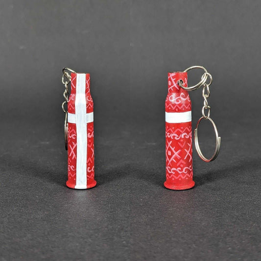 Small caliber keychain painted in Danish flag colors