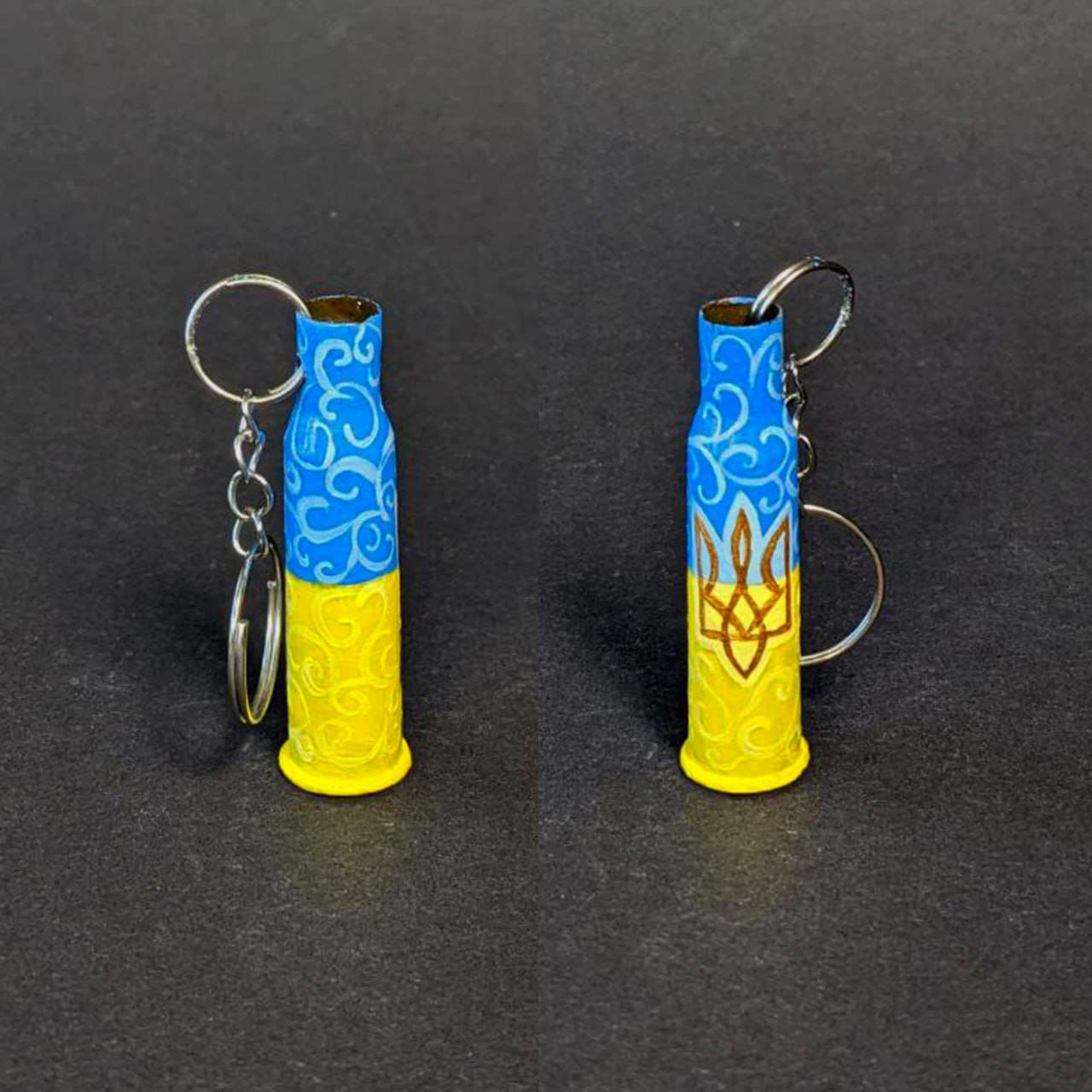 Small caliber keychain painted with Ukrainian flag colors