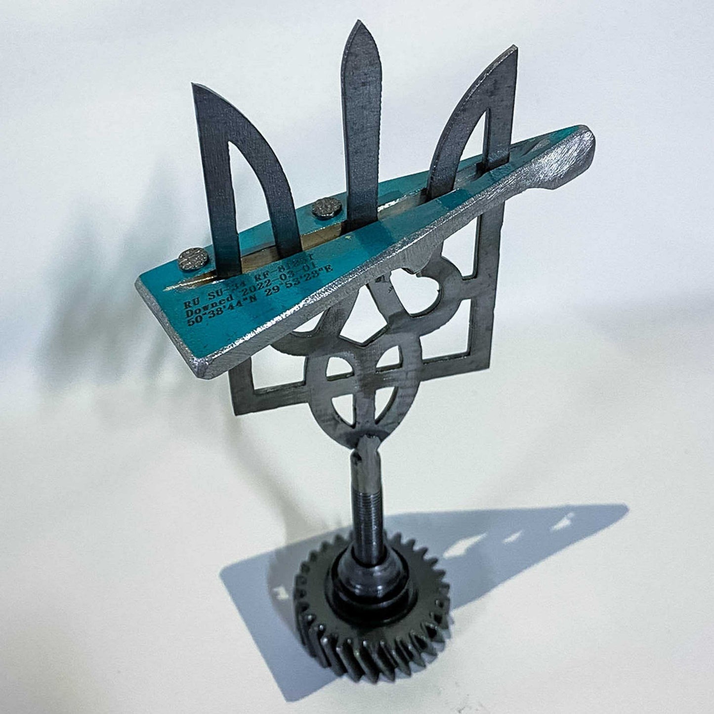 Small Tryzub 14cm with piece of Russian Su-34 fighter-bomber mounted on Ukrainian Coat of Arms pedestal
