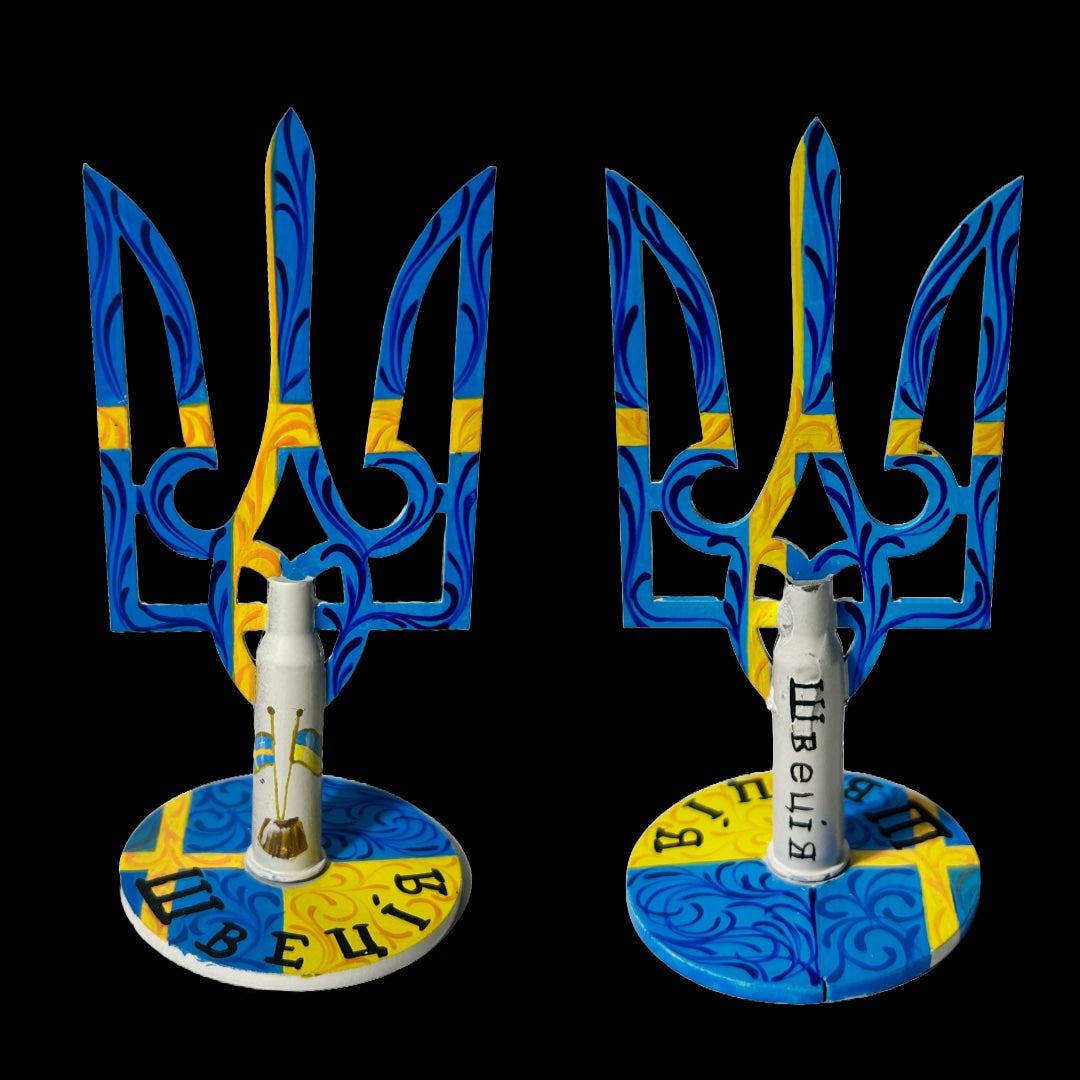 Swedish flag painted on small Tryzub with bullet cartridge artwork by Victory Gallery artist Anastasia Leonova