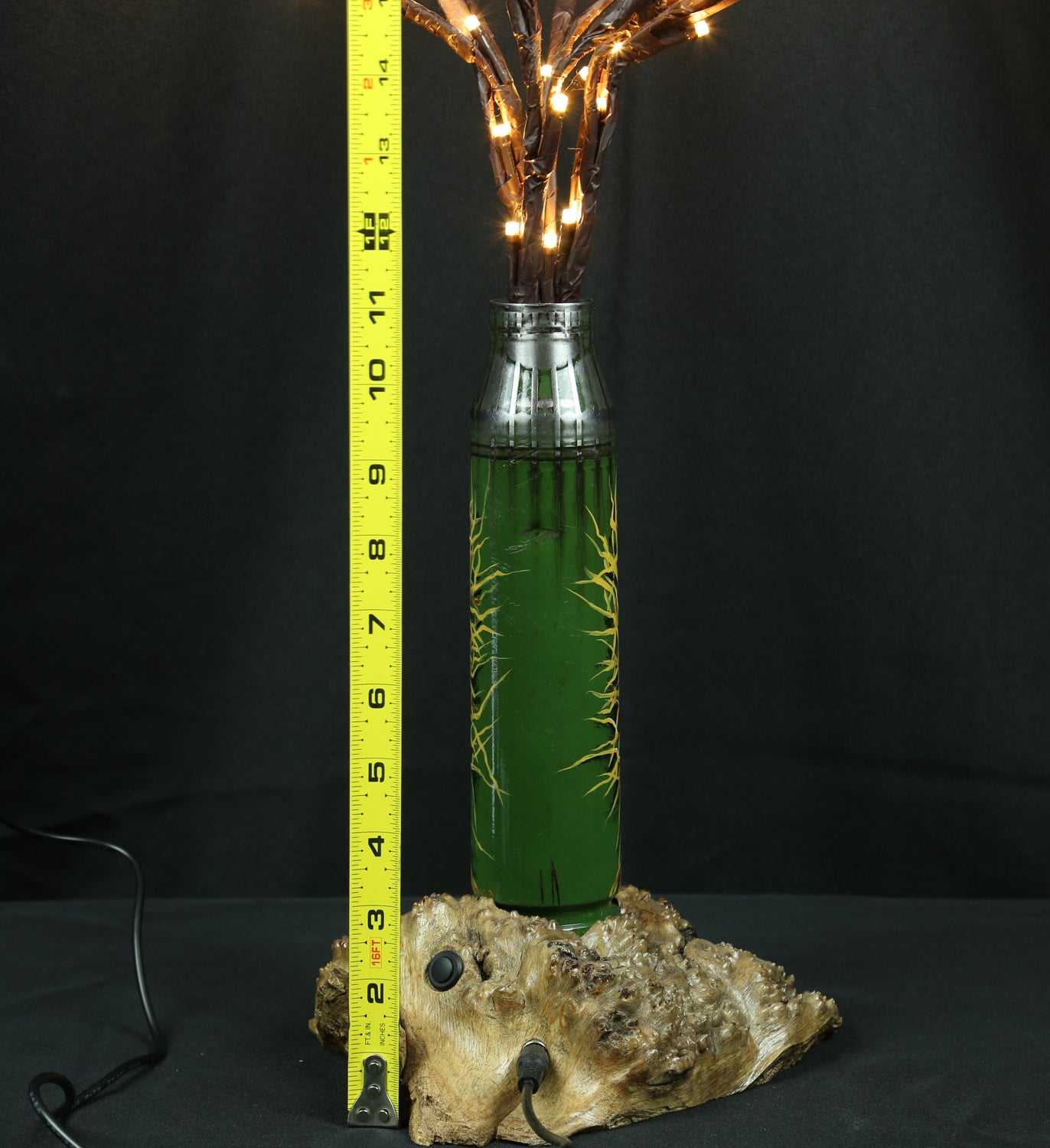 Tree of light sculpture growing from Gepard shell near European 220V outlet designed by Tanya Shacun