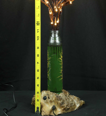 Tree of light sculpture growing from Gepard shell near European 220V outlet designed by Tanya Shacun