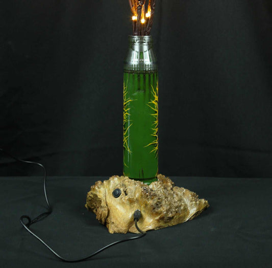 Tree of light sculpture growing from spent Gepard shell near European outlet designed by Tanya Shacun
