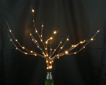 Tree of light sculpture growing from spent Gepard shell near European 220V outlet designed by Tanya Shacun