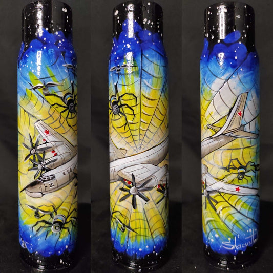 TU-95 aircraft trapped in a Ukrainian spiderweb painted on a 30mm shell by Tanya Shacun