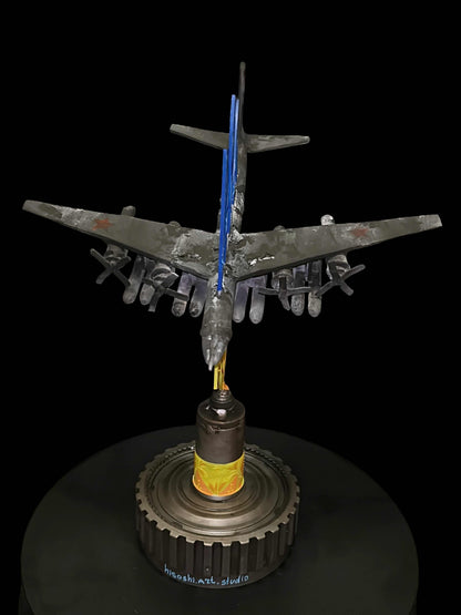 TU-95 aircraft impaled on Tryzub sculpture by Hisoshi Art Studio