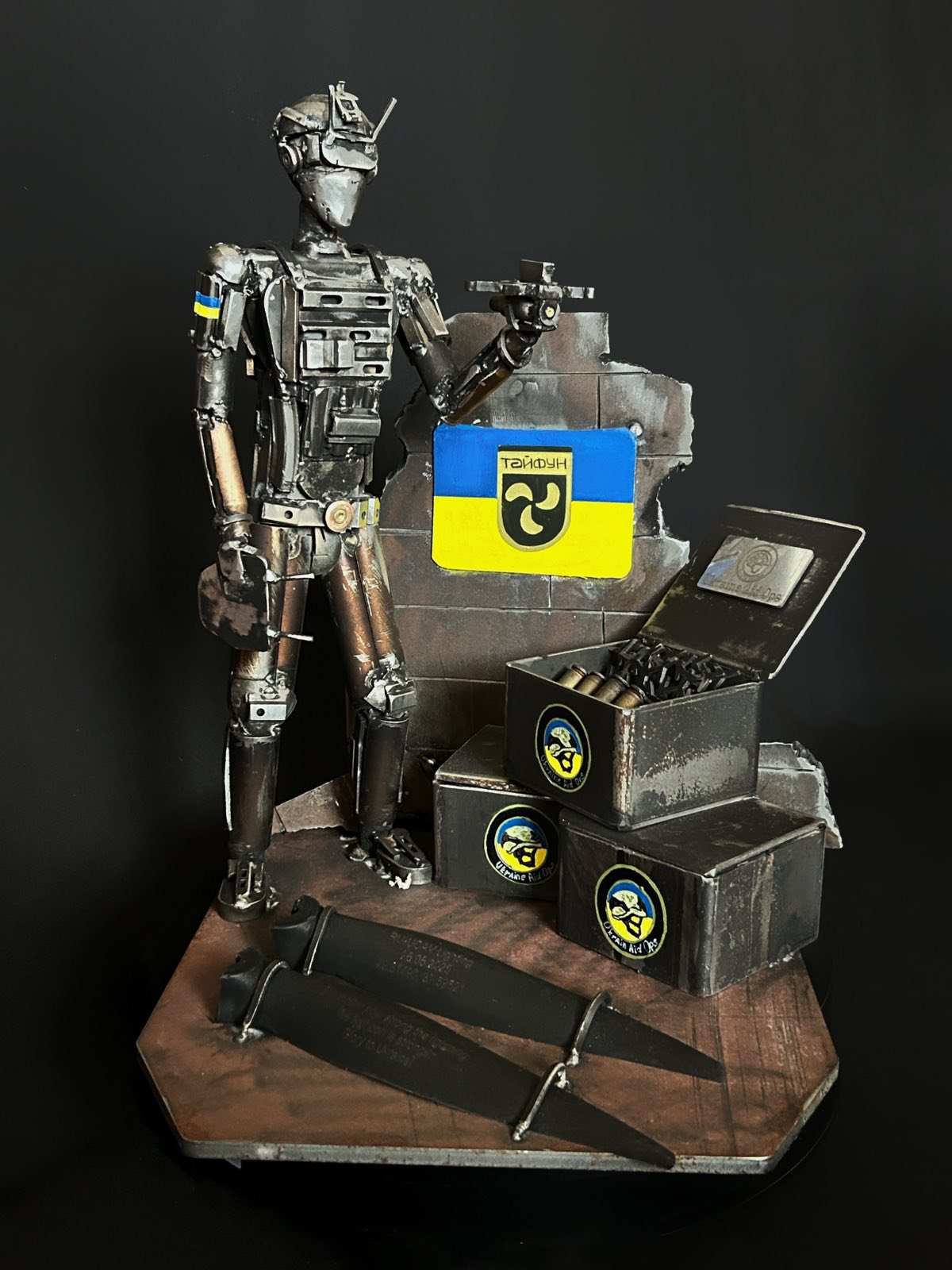 Soldier of Special Forces Typhoon receiving drones from Ukraine Aid Ops with engraved propeller from intercepted Russian drone