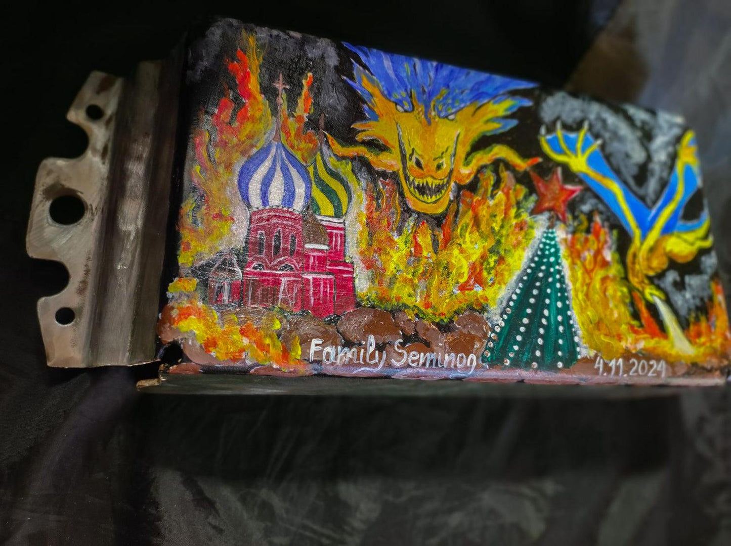 Ukrainian Dragon artwork burning down the Kremlin painted on tank turret piece