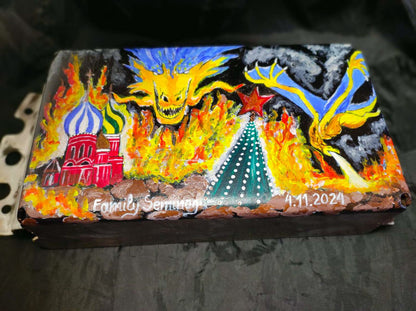 Ukrainian Dragon artwork burning down the Kremlin on a tank turret piece painted by family in garden