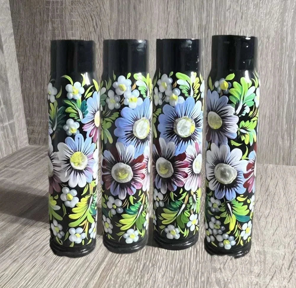 Ukrainian reward system painted shell casing with glossy black finish and vivid hand-painted flowers and green leaves