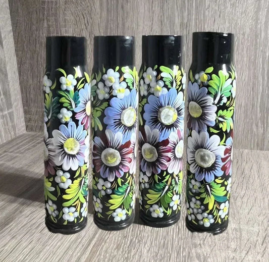 Ukrainian reward system painted shell casing with glossy black finish and vivid hand-painted flowers and green leaves