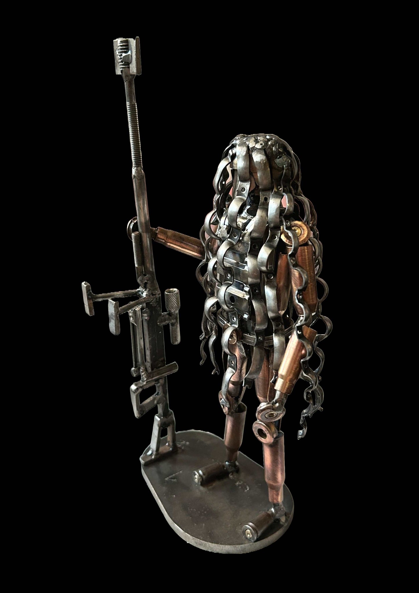 Sculpture of Ukrainian sniper in camouflage made from frontline shells