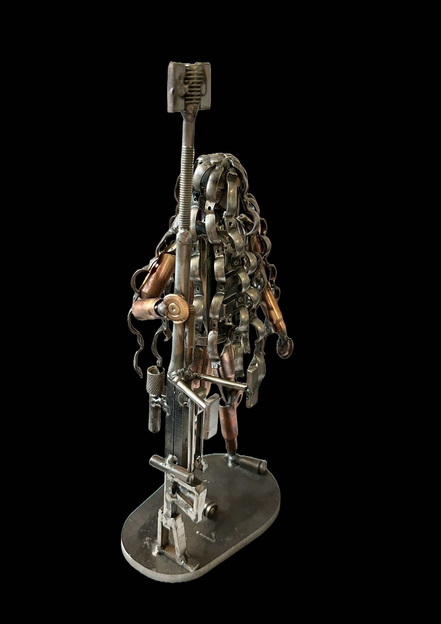 Sculpture of Ukrainian sniper in camouflage made from frontline shells by Hisoshi Art Studio