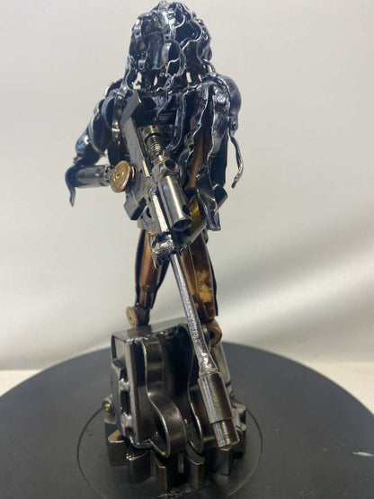 Sculpture of Ukrainian soldier in camouflage made from frontline shells, 27cm tall