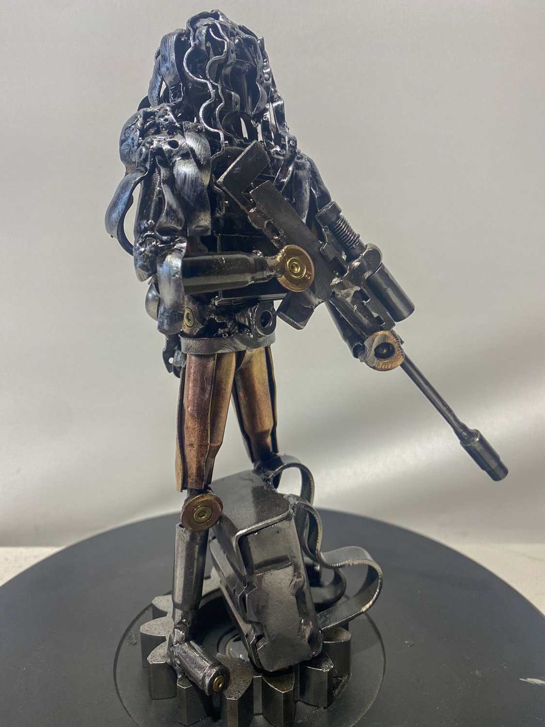 Sculpture of a 27cm Ukrainian soldier in camouflage made from frontline shells by Hisoshi Art Studio