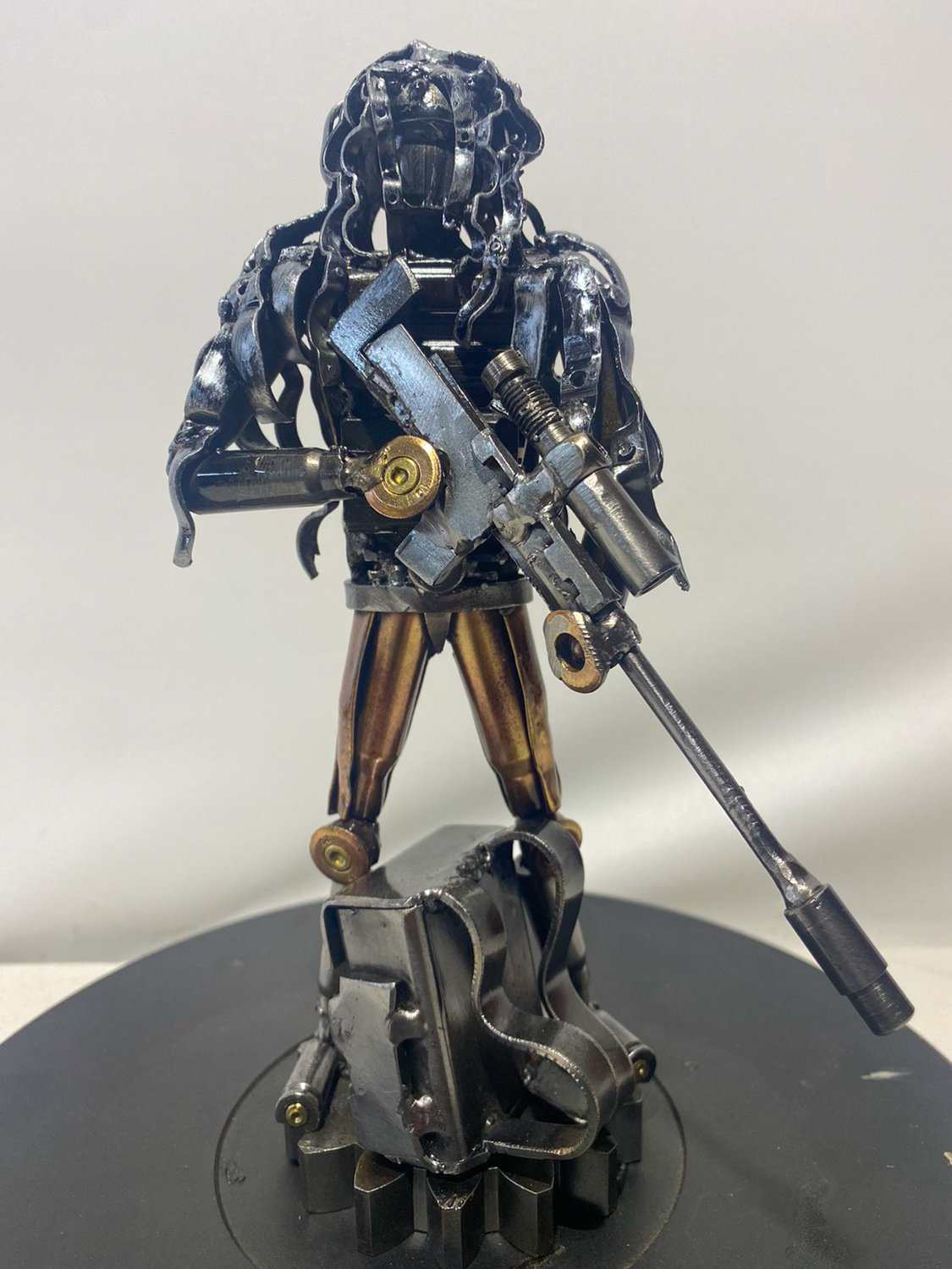 Sculpture of Ukrainian soldier in camouflage made from frontline shells by Hisoshi Art Studio, 27cm tall
