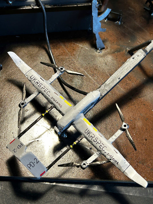 Ukrainian soldiers launching Ukrspecsystems PD-2 reconnaissance drone outdoors