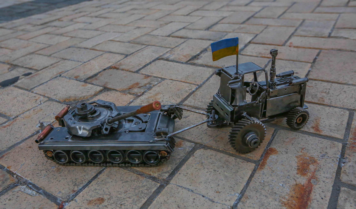 Ukrainian tractor pulling a Russian tank artwork by Hisoshi Art Studio