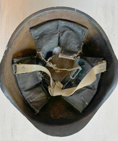 Close-up of 30mm helmet shell with detailed "window view" artwork by Anna Huliaieva