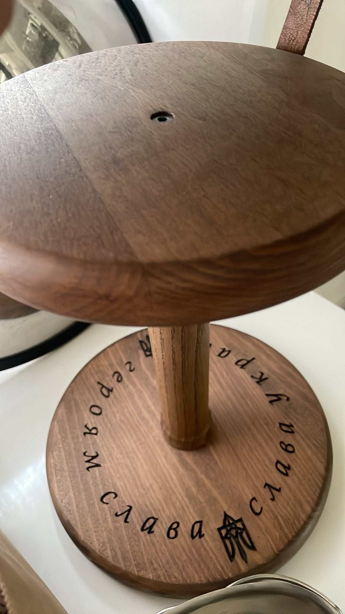 Wooden helmet stand designed by Vitaliy Shacun with natural wood finish
